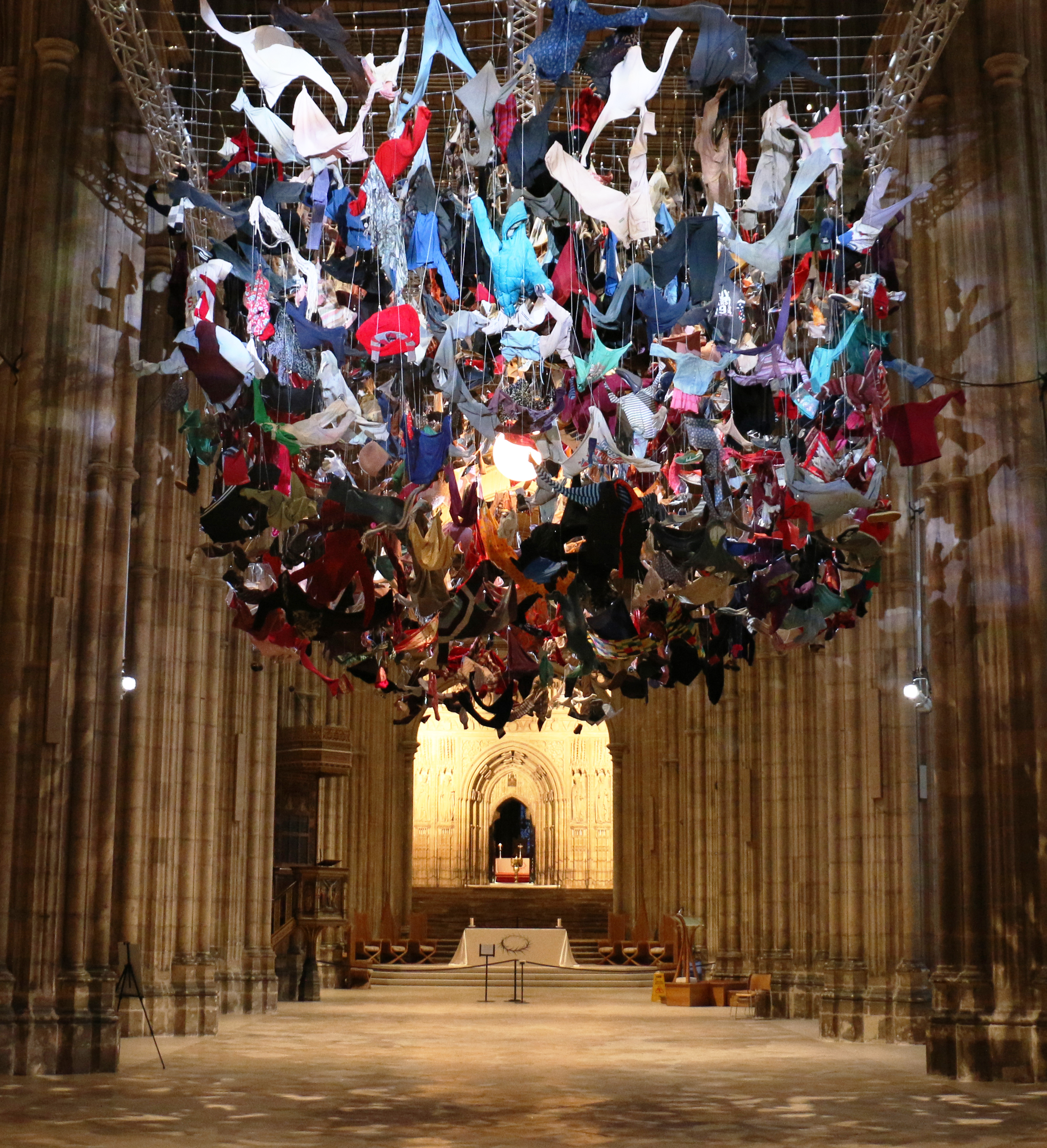 An installation of hanging clothes in Canterbury Cathedral.