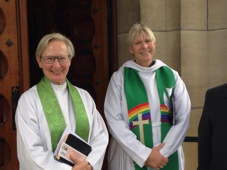 Two clergy members posing for a photo.