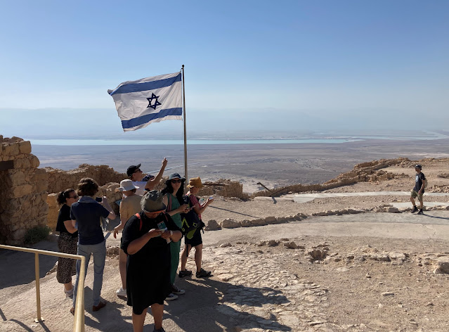 A group holds the Israeli flag.