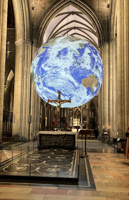 A lit globe inside Nidaros Cathedral.