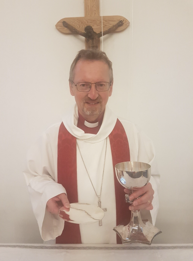 Bishop Robert with his gifts of a chalice and pattern.