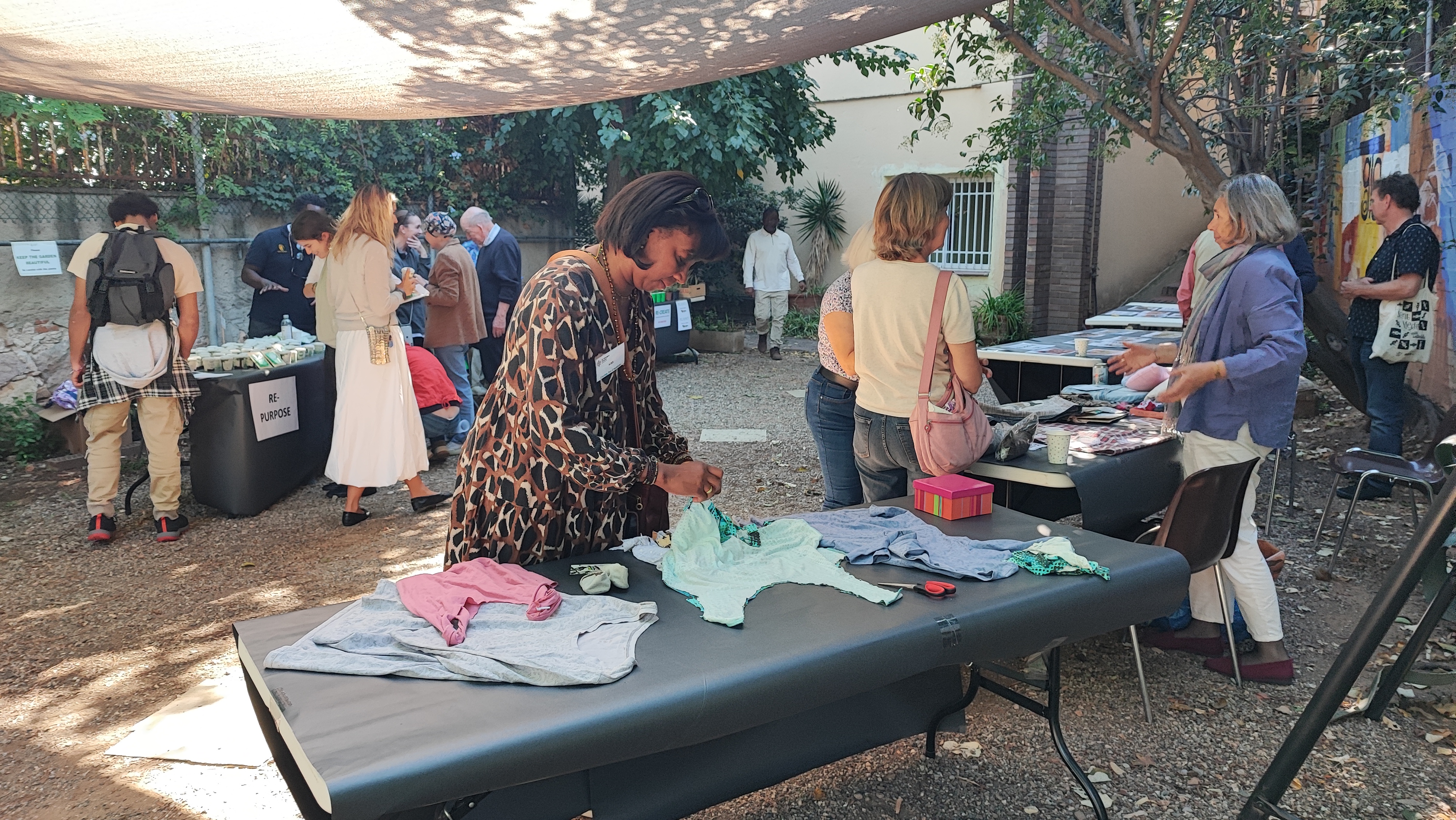 Making tote bags at clothing stall