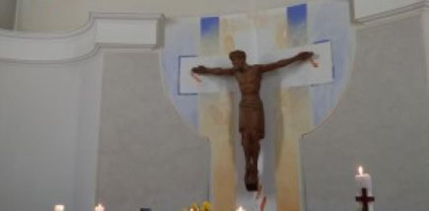 A wooden jesus on the cross.