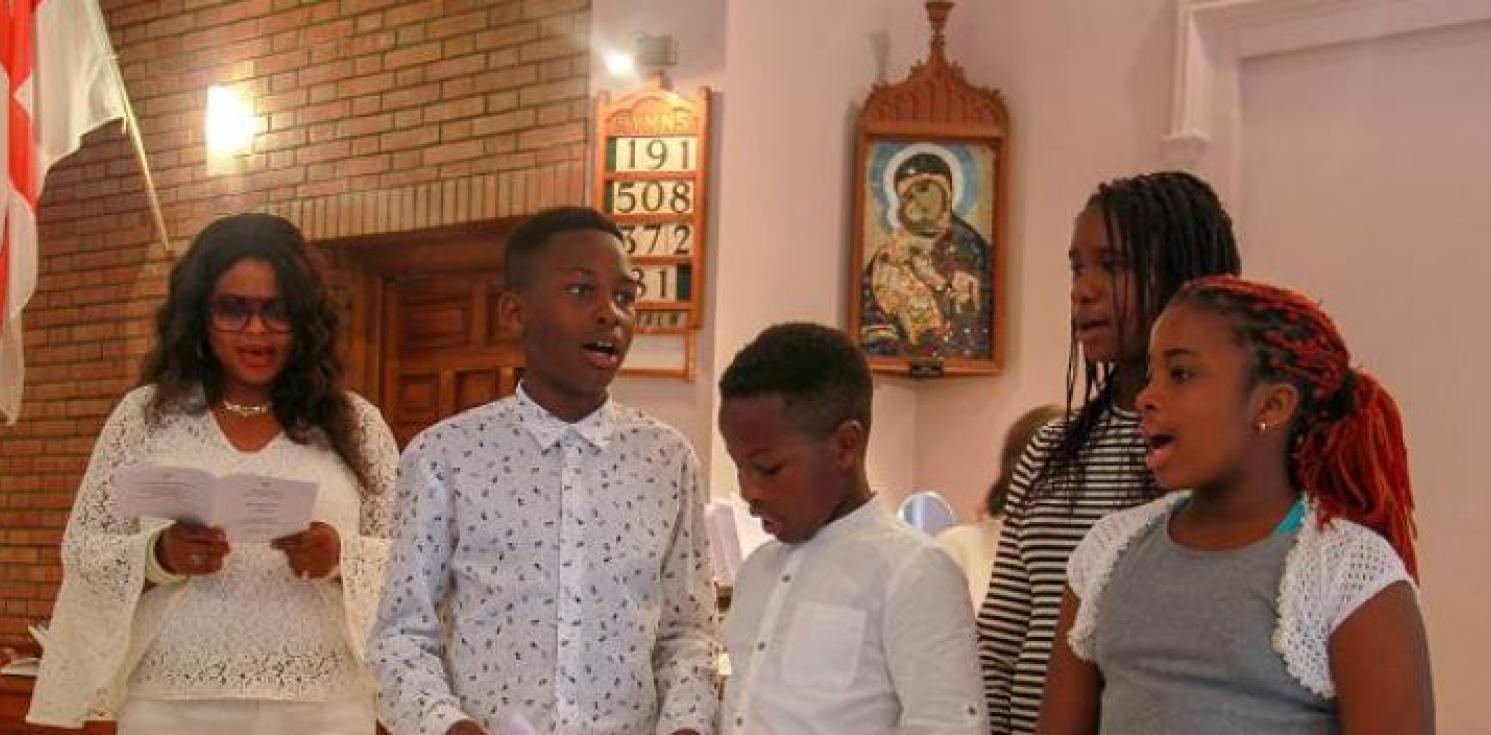 A group singing at a confirmation.