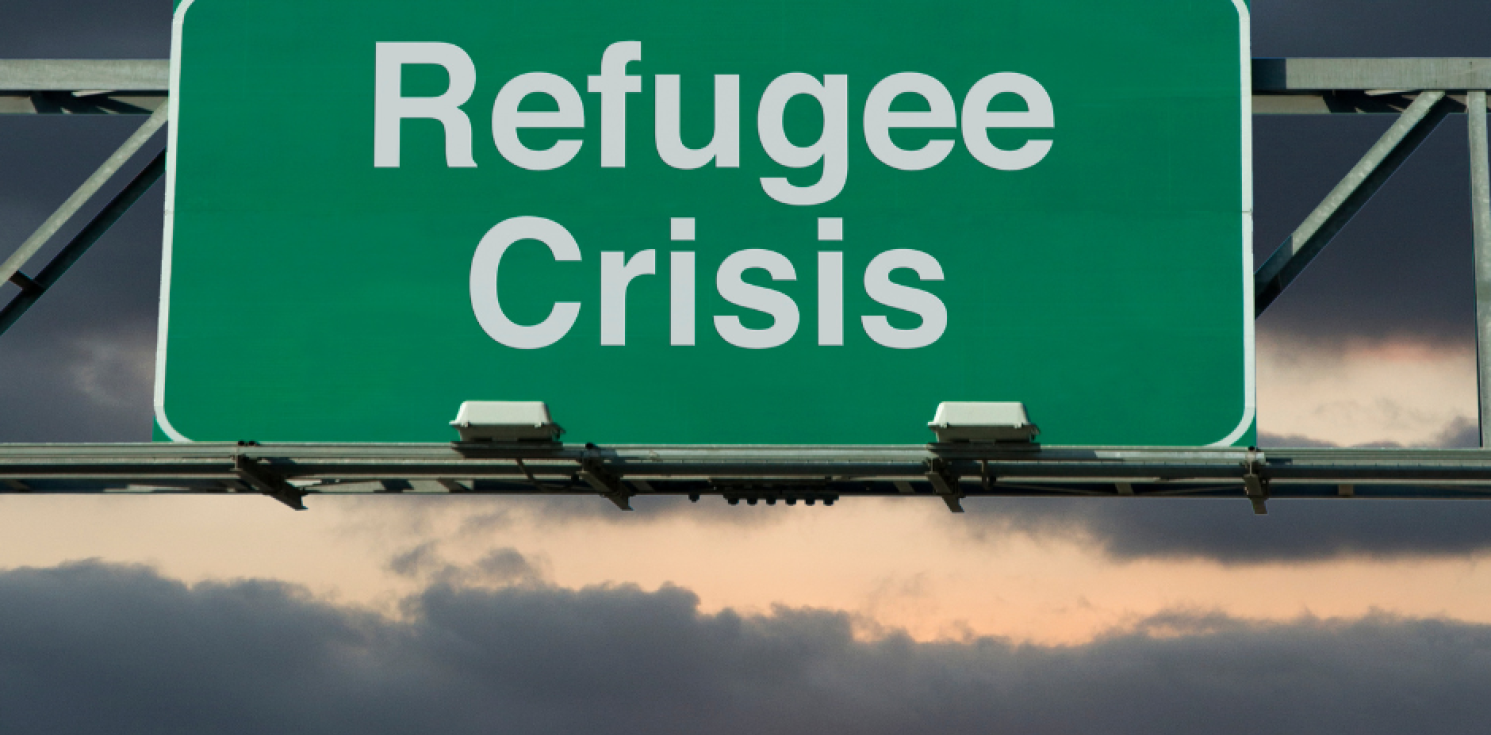 refugee crisis sign and sunset