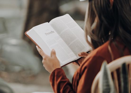 girl reading a bible