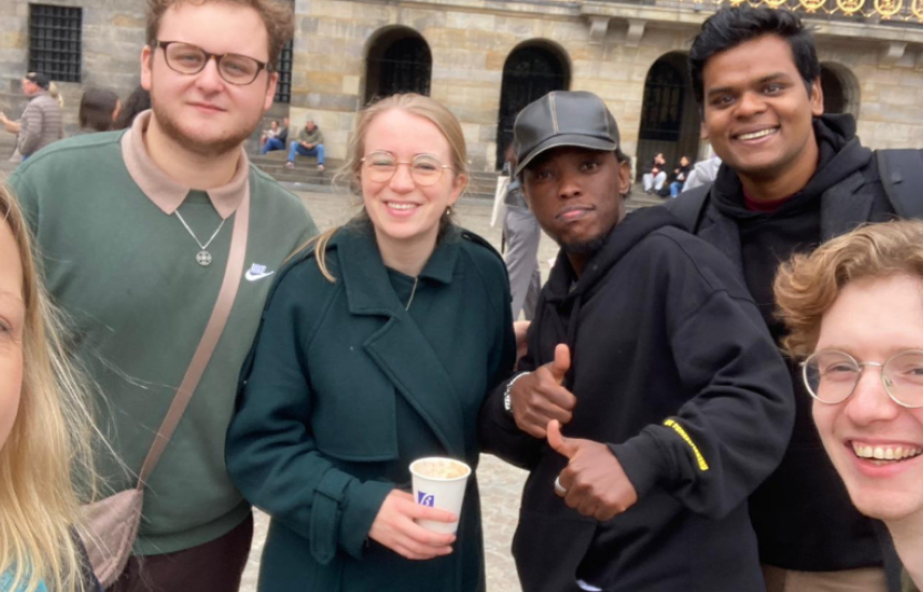 six young people smile to camera