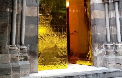 An ornate golden door.