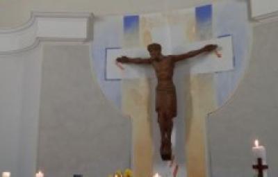 A wooden jesus on the cross.