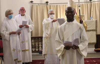 Father Solomon Ike being ordained.